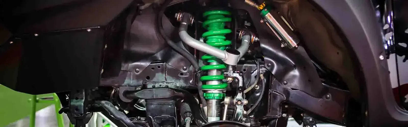 Coilover suspension and control arm fitted to an SUV